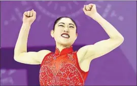  ?? Maddie Meyer Getty Images ?? MIRAI NAGASU, who became the first U.S. woman to land a triple axel at an Olympics, celebrates after competing in the single free skating event on Monday.