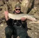  ?? Courtesy of Kevin Snyder ?? Kevin Snyder of Baden with the 37inch muskie he dived in to retrieve below New Brighton Dam on the Beaver River.