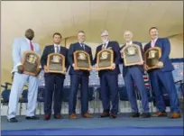  ?? HANS PENNINK — ASSOCIATED PRESS ?? From left, Vladimir Guerrero, Trevor Hoffman, Chipper Jones, Jack Morris, Alan Trammell, and Jim Thome, hold their plaques after the induction ceremony on July 29 in Cooperstow­n, N.Y.