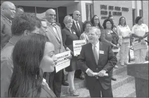 ?? Arkansas Democrat-Gazette/BENJAMIN KRAIN ?? Gary Smith (center), chairman of the Committee to Rebuild Our Schools Now!, is surrounded by business and community leaders and Little Rock School District teachers, student and parents during a news conference Wednesday advocating for the extension of...