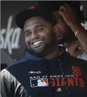  ?? KARL MONDON — BAY AREA NEWS GROUP ?? The San Francisco Giants’ Pablo Sandoval smiles in the dugout before a game in 2019. Sandoval now plays for the Atlanta Braves.