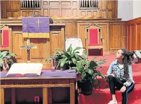  ?? NATALIE PREDDIE PHOTOS ?? Above, writer Natalie Preddie inside the 16th Street Baptist Church in Birmingham, Ala., the site of a bombing in 1963.
Left, a crosswalk leading to the Alabama state capitol is marked with footprints, a nod to where protesters once marched.