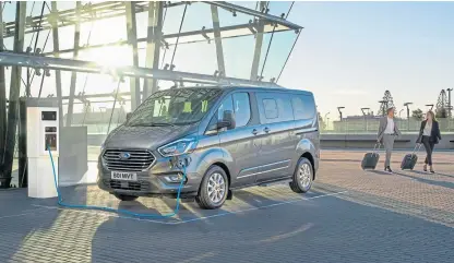  ??  ?? The Ford Transit plug-in hybrid has a 35-mile electric range and can be charged from a standard electrical outlet in a little over four hours.