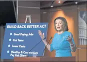  ?? J. SCOTT APPLEWHITE — THE ASSOCIATED PRESS ?? Speaker of the House Nancy Pelosi, D-Calif., talks to reporters about plans to pass President Joe Biden’s domestic agenda as the House meets to debate the Build Back Better Act at the Capitol in Washington on Thursday.