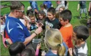  ?? JOHN BREWER — ONEIDA DAILY DISPATCH ?? Each Seneca Street fifth grader who assisted the City of Oneida plant a red maple at Allen Park received a tree to take home and plant.