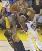  ?? The Associated Press ?? Golden State Warriors forward Kevin Durant, right, shoots over Cleveland Cavaliers guard Kyrie Irving during the first half of Game 1 of the NBA Finals in Oakland, Calif., on Thursday.