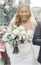  ??  ?? The bride is showered with confetti after the ceremony.