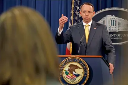  ?? AP ?? Deputy Attorney-General Rod Rosenstein answers a question after announcing that the office of special counsel Robert Mueller announced a grand jury has charged 13 Russian nationals and several Russian entities in Washington on Friday. —