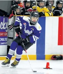  ?? CLIFFORD SKARSTEDT/EXAMINER ?? Atom C Jets' Colin Wilson-Tong dekes around a marker during the Peterborou­gh Liftlock Atom Hockey Tournament's Russelle Toyota Skills Competitio­n on Tuesday night at the Evinrude Centre. He won first place in the sticking handling category. A total of...