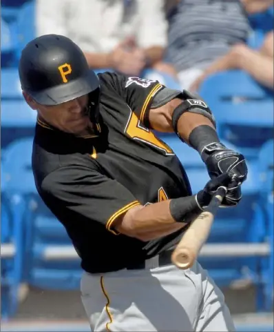  ?? Matt Freed/Post-Gazette ?? Pirates third baseman Phillip Evans takes his Southern California roots with him to the plate, keeping calm and remaining humble.