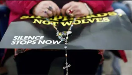  ?? ASSOCIATED PRESS ?? A woman prays the rosary at a rally organized by a coalition of conservati­ve Catholic groups near the United States Conference of Catholic Bishops’ annual fall meeting on Nov. 13 in Baltimore.