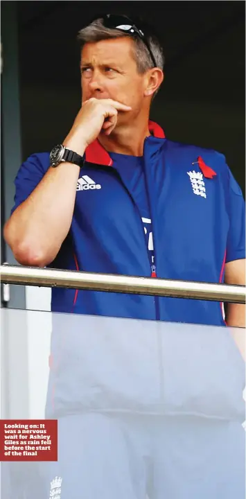  ??  ?? Looking on: It was a nervous wait for Ashley Giles as rain fell before the start of the final