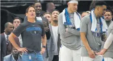  ?? Associated Press ?? Mavericks owner Mark Cuban, with hand sanitizer clipped to his jeans, watches the March 11 game vs. the Nuggets.