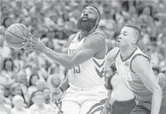  ?? Michael Ciaglo / Houston Chronicle ?? Jazz coach Quin Snyder praised the court awareness of guard James Harden, left, after the Rockets beat Snyder’s team in Game 3 of the second-round series in Utah.