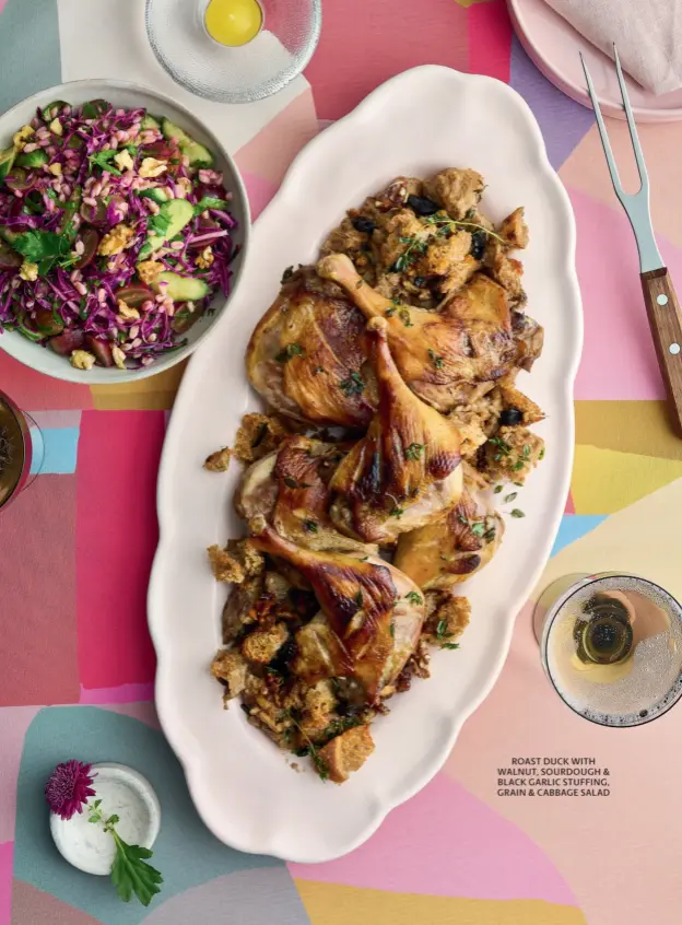  ?? ?? ROAST DUCK WITH WALNUT, SOURDOUGH & BLACK GARLIC STUFFING, GRAIN & CABBAGE SALAD