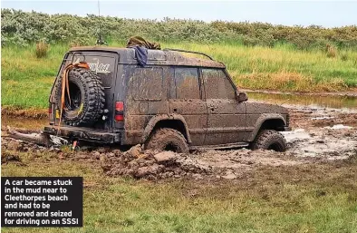  ?? ?? A car became stuck in the mud near to Cleethorpe­s beach and had to be removed and seized for driving on an SSSI