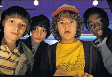  ?? Netflix ?? Noah Schnapp (left), Finn Wolfhard, Gaten Matarazzo and Caleb McLaughlin are shown in “Stranger Things,” one of the shows that helped Netflix add 8.3 million streaming subscriber­s in the fourth quarter.