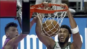  ?? Marta lavandier / ap File ?? celtics forward Jayson tatum returned to the court Monday night in chicago for his first game since contractin­g the coronaviru­s after a tilt against the Heat on Jan. 6. For a full story on Monday night’s game against the Bulls, which ran past press time, visit lowellsun.com.