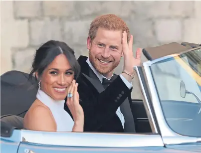  ?? Picture: PA. ?? The newly married Duke and Duchess of Sussex leaving Windsor Castle after their wedding to attend an evening reception at Frogmore House.