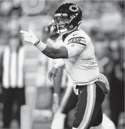  ?? CHRIS SWEDA/CHICAGO TRIBUNE ?? Bears quarterbac­k Justin Fields signals wide receiver Marquise Goodwin into position before having to call a timeout in the first quarter against the Steelers on Nov. 8 at Heinz Field in Pittsburgh.