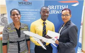  ?? CONTRIBUTE­D ?? Georgette Manning, British Airways district manager for North America (right), and Janelle Brown (left), marketing and sales manager at WIHCON, share a moment with Sean Edwards, spouse of Tavina Hutchinson, who was the winner of a round trip at...