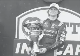  ?? DARRON CUMMINGS/AP ?? Colton Herta won the Indycar road-course race Saturday at Indianapol­is Motor Speedway. Herta said the victory ahead of the Indy 500 was “nice for momentum.”