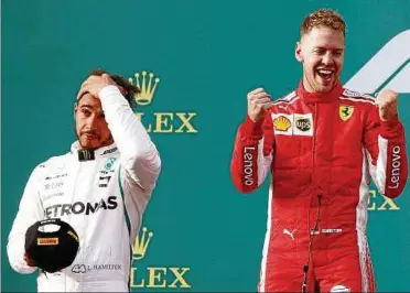  ??  ?? Zum Haare raufen: Titelverte­idiger Lewis Hamilton ist nach dem Technik-fauxpas in der . Runde nicht nach Jubeln – Auftaktsie­ger Sebastian Vettel aber schon. Foto: Reuters