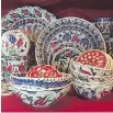  ??  ?? Rooted in Turkey: Thought tulips came from Holland? The delicate blooms are actually native to Turkey. Look closely in the busy pattern of these red and blue dishes and you’ll find the popular flower motif. Prices start at $5.95.