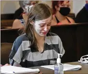  ?? BILL LACKEY PHOTOS / STAFF ?? Natasha Ellis, 17, tears up as she reads a letter she wrote, apologizin­g to Paul Greear for fatally stabbing his wife and attacking him, during her sentencing Friday.