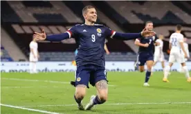  ??  ?? Scotland’s Lyndon Dykes celebrates scoring the only goal of Nations League game against Slovakia at Hampden Park. Photograph: Steve Welsh/PA