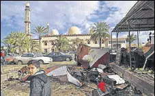  ?? AFP ?? Libyans check the aftermath of the explosions on Wednesday.