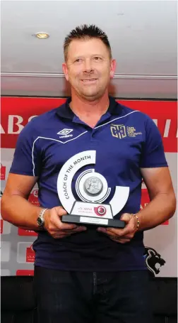  ??  ?? GIVE US A SMILE, COACH: Cape Town City coach Eric Tinkler poses with his trophy after winning Coach of the Month for December. See page 22.