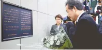  ?? Korea Times photo by Choi Won-suk ?? Prime Minister Lee Nak-yon pays tribute to a memorial stone for Lee Su-hyun, who died to save a Japanese man who fell onto train tracks in Japan in January 2001, at Tokyo’s Shin-Okubo Station, Tuesday. His death has been considered a symbol of sacrifice for human beings and friendly relations between Korea and Japan. Lee visited the site on the sidelines of a ceremonial event for Japanese Emperor Naruhito’s enthroneme­nt.