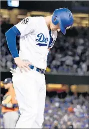  ?? Wally Skalij Los Angeles Times ?? DODGERS f irst baseman Cody Bellinger shows his frustratio­n after making an out against Houston in Game 7. He struck out a record 17 times in the Series.