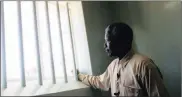  ??  ?? ICONIC: Nelson Mandela on a visit to his prison cell on Robben Island.