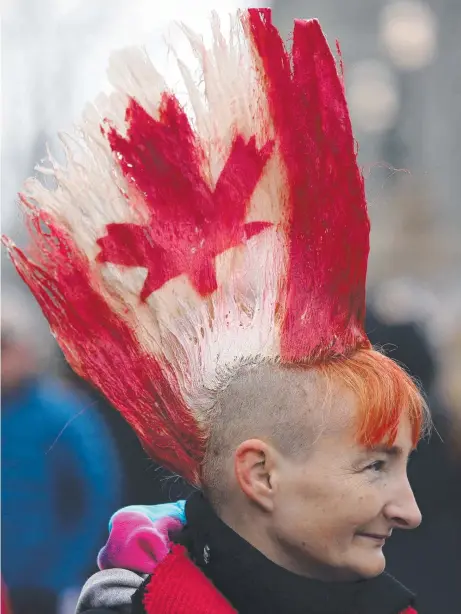  ?? Picture: AFP ?? A protester in Ottawa shows where her loyalty lies.