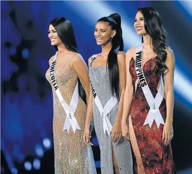 ?? Picture: AFP ?? FAIREST OF ALL: Here they are, from left, Sthefany Gutierrez, of Venezuela, South Africa’s Tamaryn Green and the winner, Catriona Gray, of the Philippine­s, on stage after being selected as the top three finalists