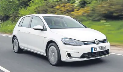  ??  ?? Volkswagen says the e-Golf can cover 186 miles on one charge.