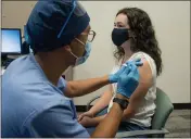  ?? COURTESY HENRY FORD HEALTH SYSTEM ?? A volunteer participat­ing in a study at Henry Ford Health System gets an injection of a possible COVID-19 vaccine, developed by Moderna Inc.