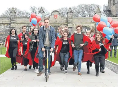  ?? Picture: Gareth Jennings. ?? Incoming St Andrews University rector Srdja Popovic toured the town on a scooter in the company of a group of undergradu­ates.