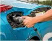  ??  ?? Filling up, Prius Prime style. The latest model can cover 63km on pure electric power.