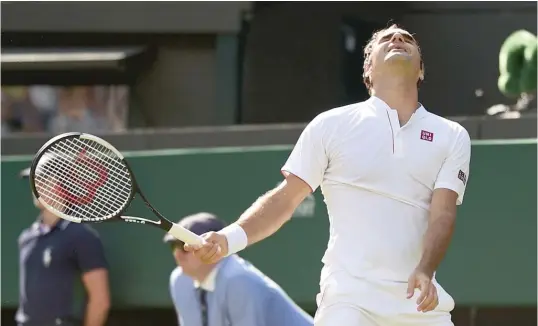  ?? GETTY IMAGES ?? Top- seeded Roger Federer blew a third- set match point and, eventually, all of his big lead in a 2- 6, 6- 7 ( 5), 7- 5, 6- 4, 13- 11 loss to No. 8 Kevin Anderson on Wednesday.