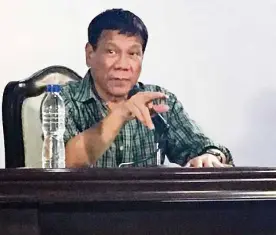  ?? TARRA QUISMUNDO ?? HOLDING COURT President-elect Rodrigo Duterte answers questions from reporters after his first Cabinet meeting on Tuesday at Malacañang of the South in Panacan, Davao City.