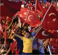  ?? AP PHOTO ?? PATRIOTIC DISPLAY: Supporters cheer as Turkey President Recep Tayyip Erdogan speaks yesterday.