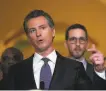  ?? Justin Sullivan / Getty Images 2019 ?? Gov. Gavin Newsom speaks at a news conference in March 2019 after suspending executions in California.