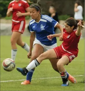  ?? DAVID BEBEE, RECORD STAFF ?? Grand River Renegades’ Kayla Ambrose, left, battles Waterloo Collegiate Institute defender Aysen Osmansoy for a loose ball Wednesday in girls’ senior soccer action at Woodside. The Renegades won, 2-0.