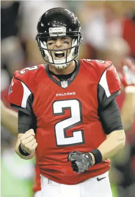  ?? STREETER LECKA/GETTY IMAGES ?? Falcons quarterbac­k Matt Ryan celebrates a touchdown in Saturday’s win over Seattle.