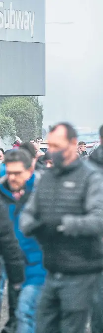  ?? Picture Andrew Cawley ?? Fans coming out of Ibrox subway station in Glasgow head for the match at Ibrox yesterday