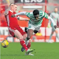  ??  ?? Jeremie Frimpong and Jonny Hayes battle it out at Pittodrie last Sunday