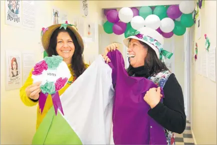  ?? PHOTO: DUNCAN BROWN ?? Heretaunga Women’s Centre service co-ordinator Cathy Barclay (left) and manager Margot Wilson preparing a display for upcoming Suffrage Day events.